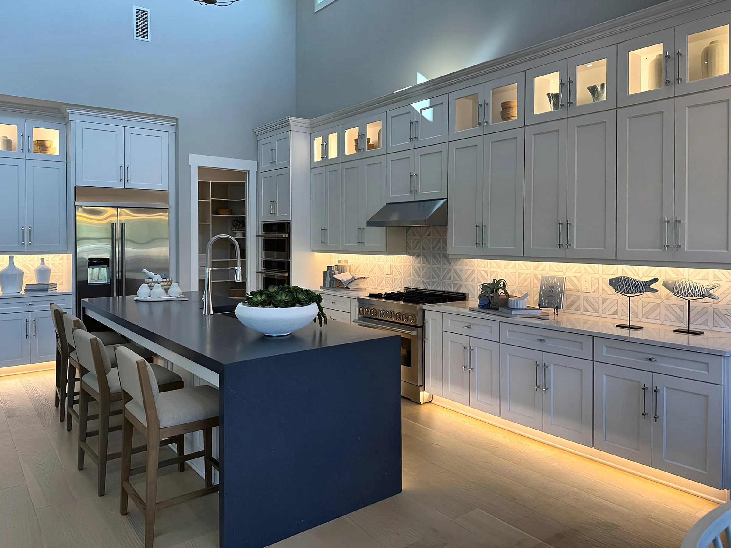 Navy Island & Lit Glass-Front Cabinets — Panama City Beach